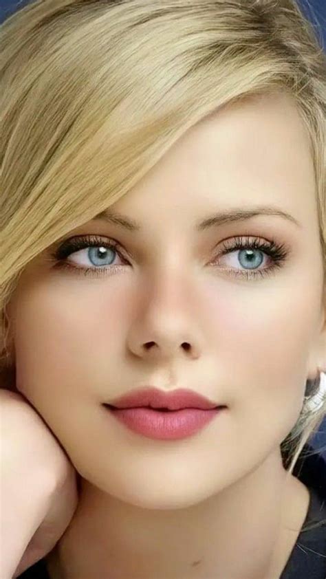 A Woman With Blonde Hair And Blue Eyes