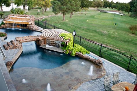 Before you can continue the construction of your concrete swimming pool, you have to wait for the concrete to cure. This pool has it all! Beach entry, swim-up bar, sunken in ...