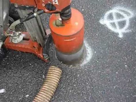 Asphalt core drilling in the street during snowfall - YouTube