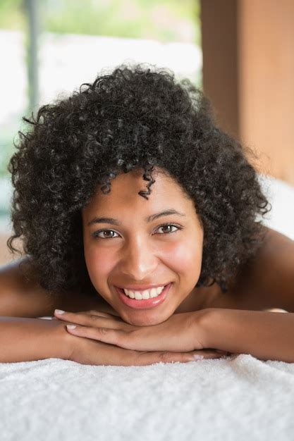 Premium Photo Gorgeous Woman Lying On Massage Table Smiling At Camera