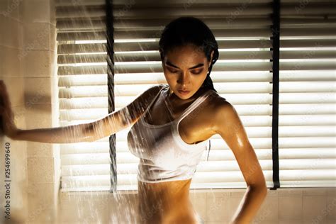 The Sexy Woman Having Shower Splashing Of Water Around Wet Body Model