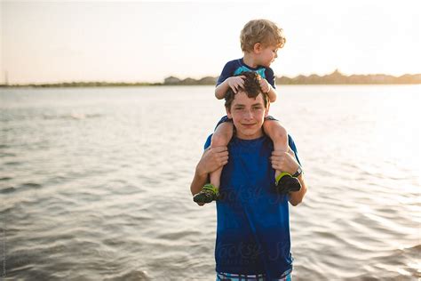 brothers at the beach by stocksy contributor courtney rust stocksy