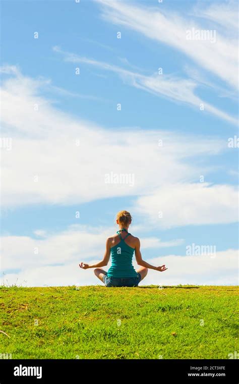 Peaceful Woman Meditating In A Tranquil Scene Enjoying Spirituality In