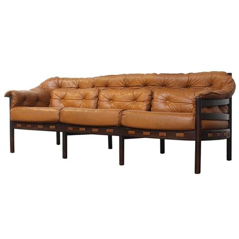 With matching wood finishes, you cant gowith matching wood finishes, you cant go wrong with this dining set. Tufted Leather Camel Colored Three-Seat Arne Norell Sofa ...