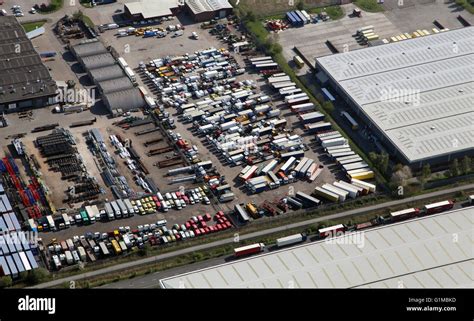 Aerial View Of A Compound Yard Full Of Old Trucks And Vehicles Stock