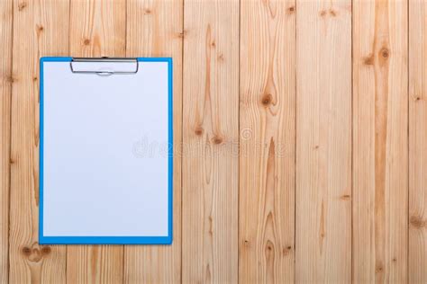 Clipboard With Blank White Paper Sheet On Wood Table Top View Wi Stock