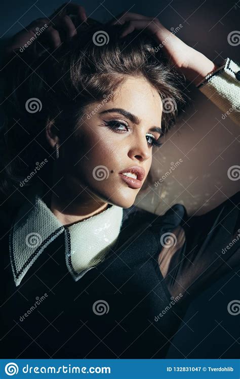 elegant girl with curly hair she is really cute fashion woman with makeup in retro style stock