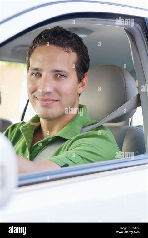 Portrait Of A Smiling Mid Adult Man Driving A Car Stock Photo Alamy