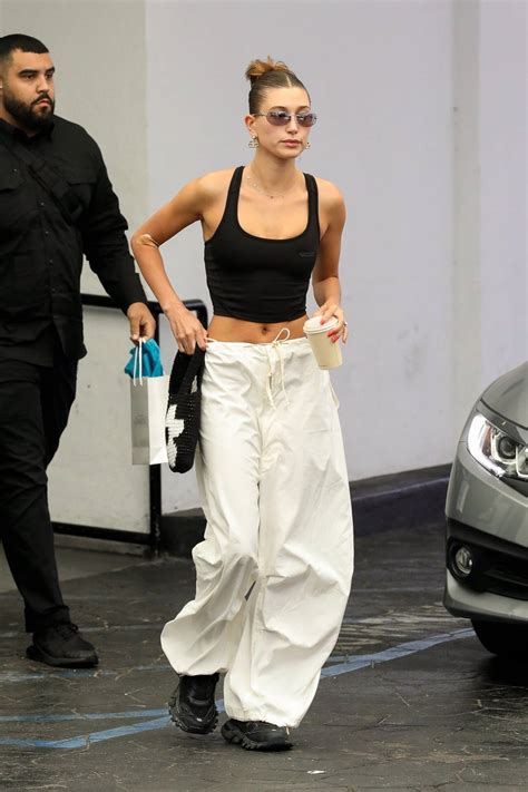 Hailey Bieber Displays Her Svelte Figure In Crop Top And Baggy Pants While Visiting A Skincare