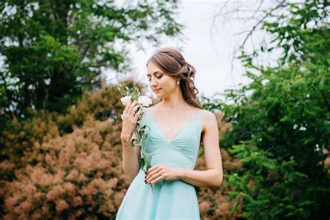Happy Girl In A Turquoise Long Dress In A Green Park Stock Image