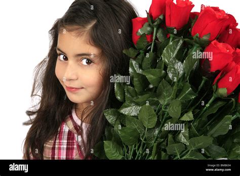Little Girl With A Bunch Of Red Roses Stock Photo Alamy