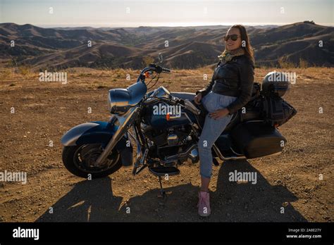 Woman Biker Sitting On Her Motorcycle Stock Photo Alamy