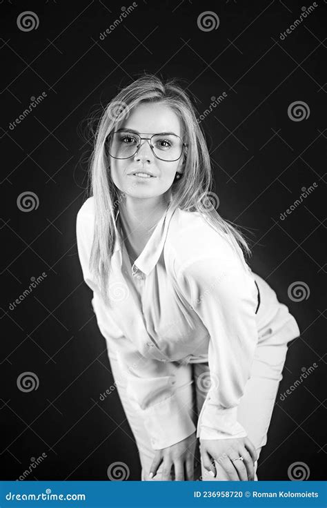 Fun Positive Young Smart Woman In Glasses And White Shirt Smiling With Perfect Teeth Stock