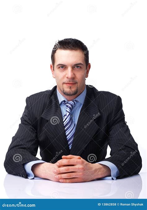 Businessman Sitting With Folded Hands Royalty Free Stock Photos