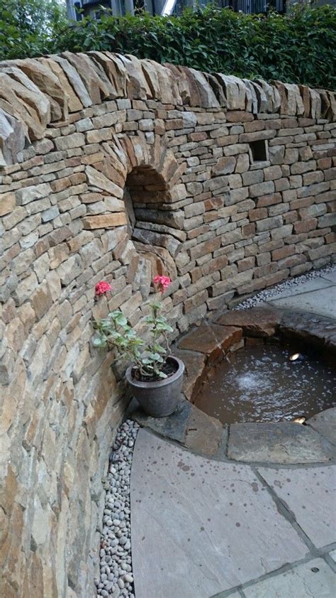 A decorative stone wall can really add personality to you garden whilst being a functional essential. 502 best images about stone wall ideas on Pinterest ...