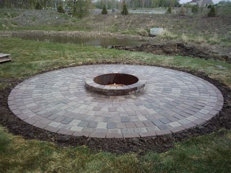 Maybe you would like to learn more about one of these? Stone fire pit ideas Rosemount, MN | Devine Design Hardscapes