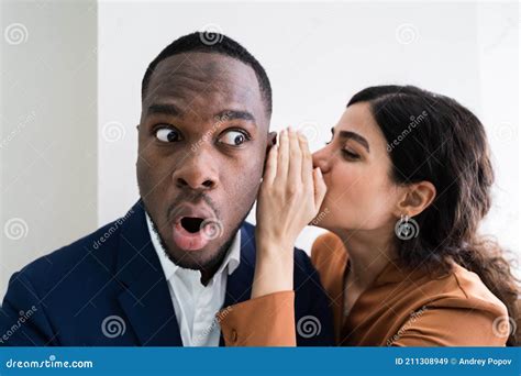 Businesswoman Whispering Into Male Partner S Ear Stock Image Image Of