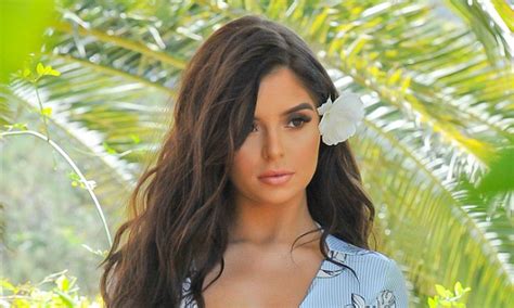 Demi Rose Flaunts Her Ample Cleavage And Peachy Derriere In Floral