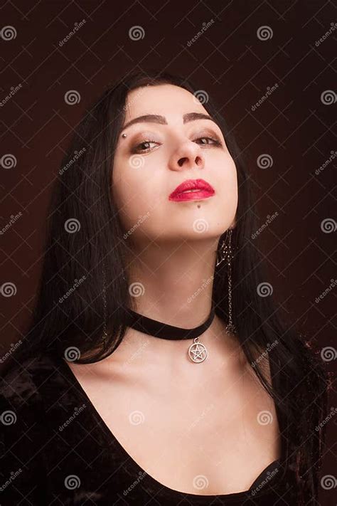 Brunette On Dark Background Dressed In Goth Style Stock Photo Image