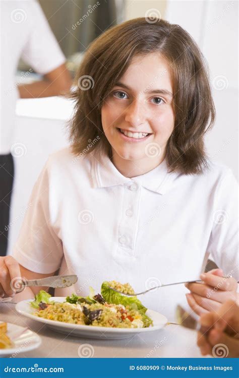 Schoolgirl Enjoying Her Lunch In School Stock Image Image Of