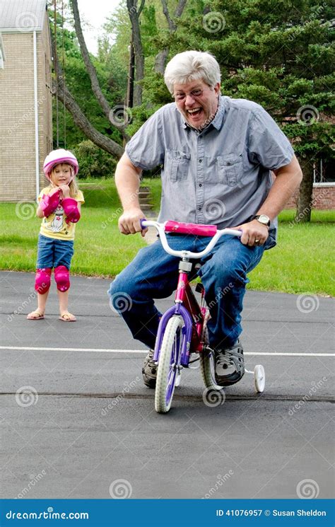 Learning To Ride A Bike With Training Wheels Stock Image Image 41076957