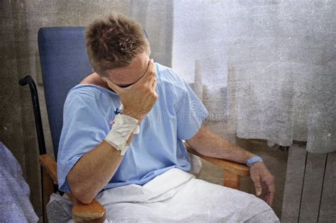 Young Injured Man Crying In Hospital Room Sitting Alone Crying In Pain