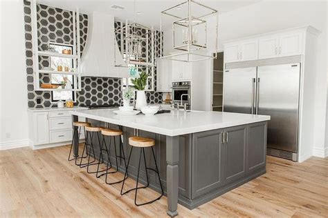 Maybe you would like to learn more about one of these? Charcoal gray kitchen island with a white quartz ...