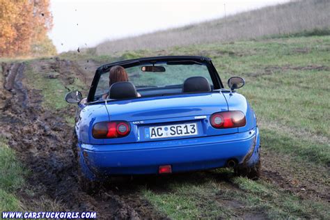 Everyone made a mad dash for the exit. Mazda Miata MX5 girl stuck on muddy field