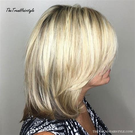 With subtle layers throughout for added movement and choppy ends, this cool shag cut is a great option for ladies with natural waves. Tousled Blonde Highlights - 20 Flattering Medium-Length Haircuts for Women Over 50 - The ...