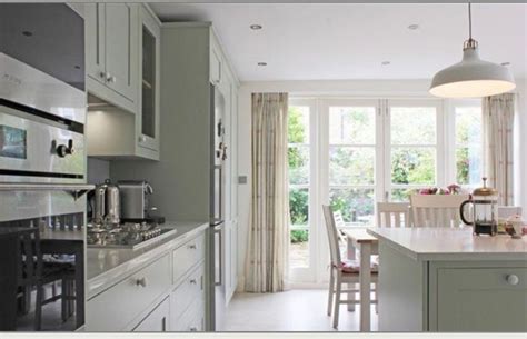 The colour reads aqua in electric light and a subtle green/grey in daylight. Mizzle, F&B | Kitchen cabinet colors, Georgian kitchen, Farrow and ball kitchen