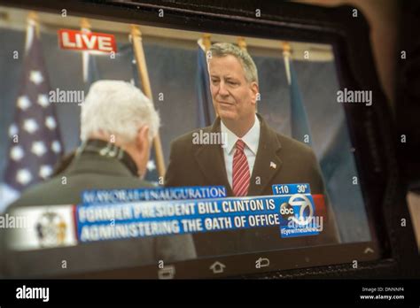 A Viewer Watches The Inauguration Of New York Mayor Bill De Blasio