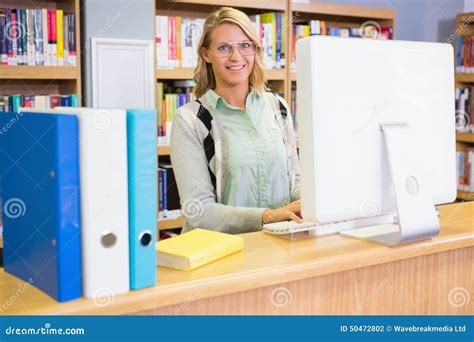 Pretty Librarian Working In The Library Stock Photo Image Of Cheerful