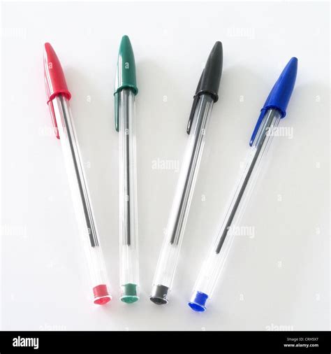 Selection Of Red Green Black And Blue Crystal Bic Pens On A White