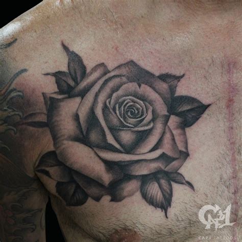 Ask your tattoo master for the name of the cream you should use to help your skin in the process of recovering. Rose Chest Tattoo (Black and Grey) by Capone: TattooNOW