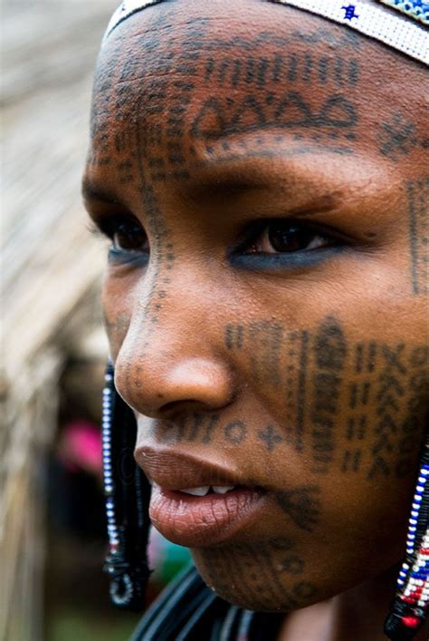 africa a peul woman covered with facial tattoos photo taken in north benin © boaz images