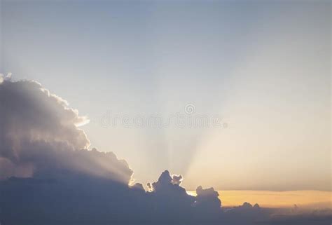 Gold Rays Of The Sun Break Through The Clouds At Dawn Stock Image