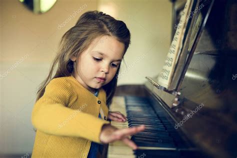 Adorable Girl Playing Piano — Stock Photo © Rawpixel 129881794