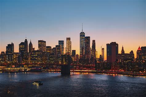 The New York City Skyline And Manhattan Bridge At Sunset Manhattan In