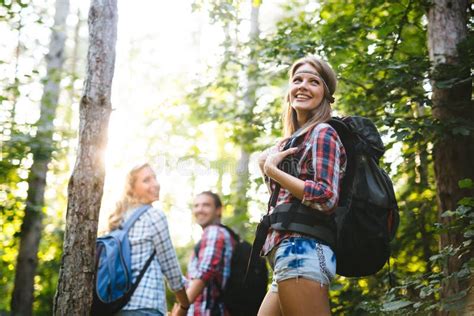 Beautiful Woman And Friends Hiking In Forest Stock Photo Image Of