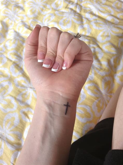 Large cross tattoos on back. My third tattoo, small cross on my wrist. Simple small and ...