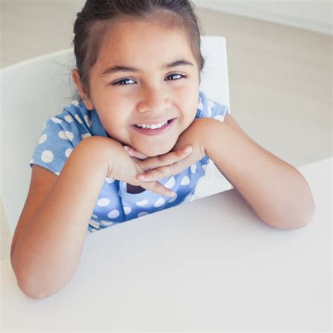 Close Up Of A Smiling Girl At Table Stock Photo Image Of Childhood