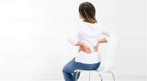 Beautiful Woman Suffering From Backache On Chair Back View Female