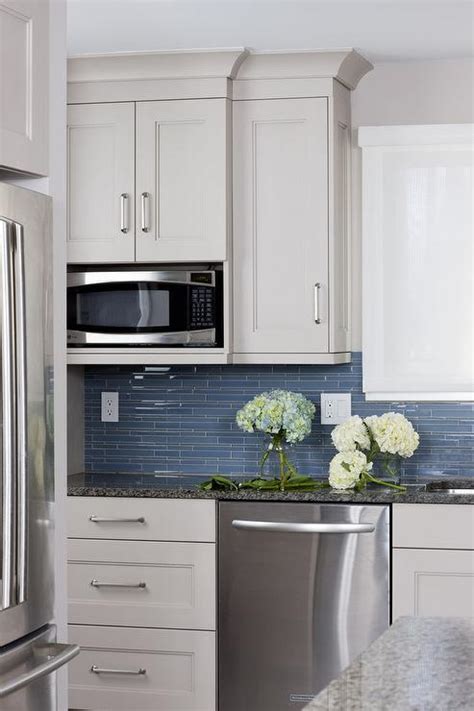 Mint grey backsplash and walls. White Kitchen Cabinets With Glass Tile Backsplash | online ...