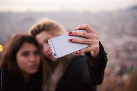 Young Girlfriends Taking Selfie Together By Stocksy Contributor Guille Faingold Stocksy