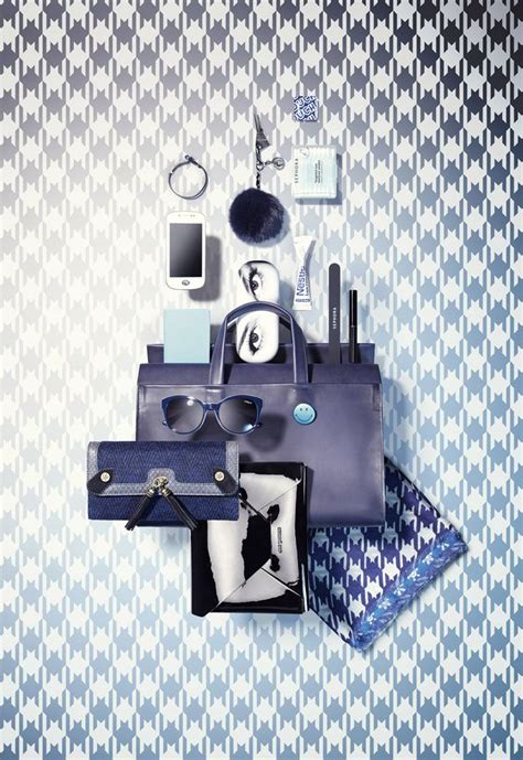 An Assortment Of Personal Items Are Arranged On A Blue And White