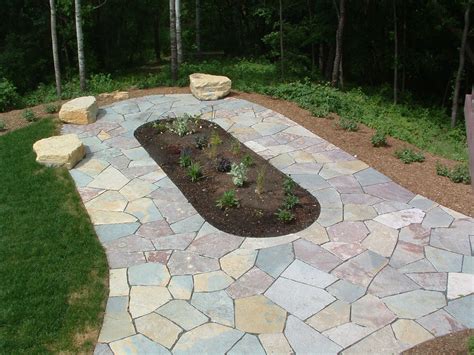 Natural Stone Patio Walkway With Flower Bed And Boulder Seating