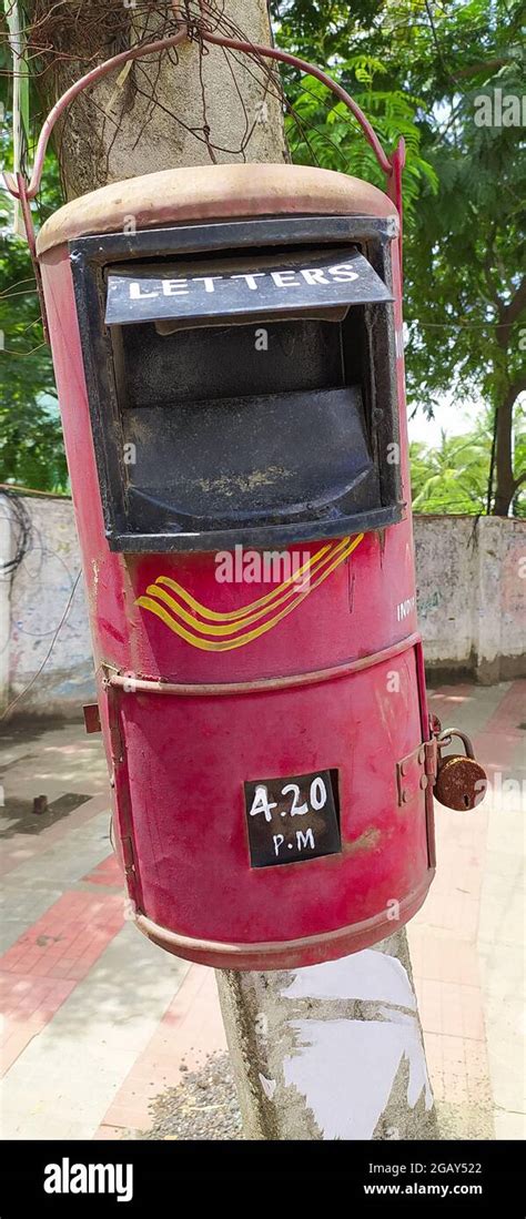The Conventional Indian Post Box In A Blur Background Of A Street