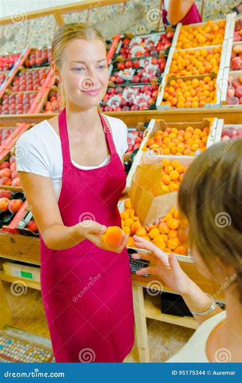 Giving Orange To Customer Stock Photo Image Of Service 95175344