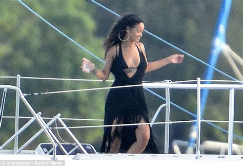 rihanna shows off her flawless figure in a halter neck bikini during a snorkelling trip with
