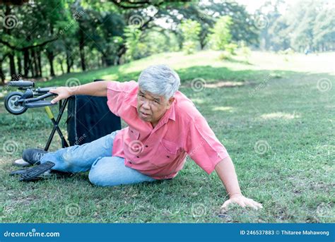Elderly Asian Man Falling Lying On The Green Lawn Stock Image Image